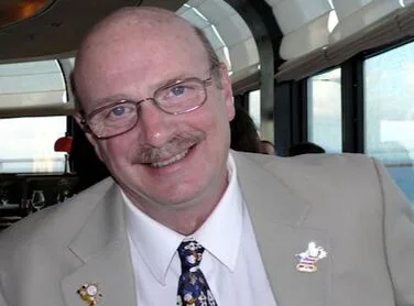 Photo of gallery manager and Disney Glass Slipper Concierge travel adviser Duane Whitman.