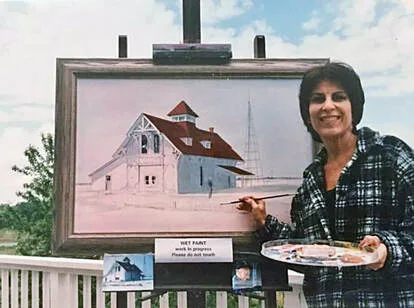 Artist Ellen Rice painting the historic last watch of the U.S. Coast Guard Station at Indian River Inlet, Delaware.