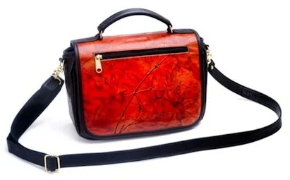 Trish Leaf Leather Bag with removable shoulder strap and handle, leaf pattern on front.