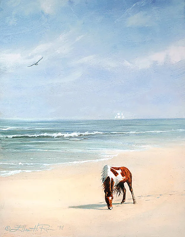 Chincoteague pony grazes on Assateague Island beach with ghostly ship on horizon prints.