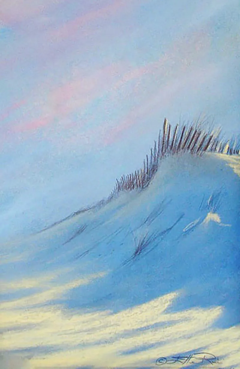 The colors of dusk and a play of shadows and light on a tall beach dune set a peaceful mood after a good day at the beach.