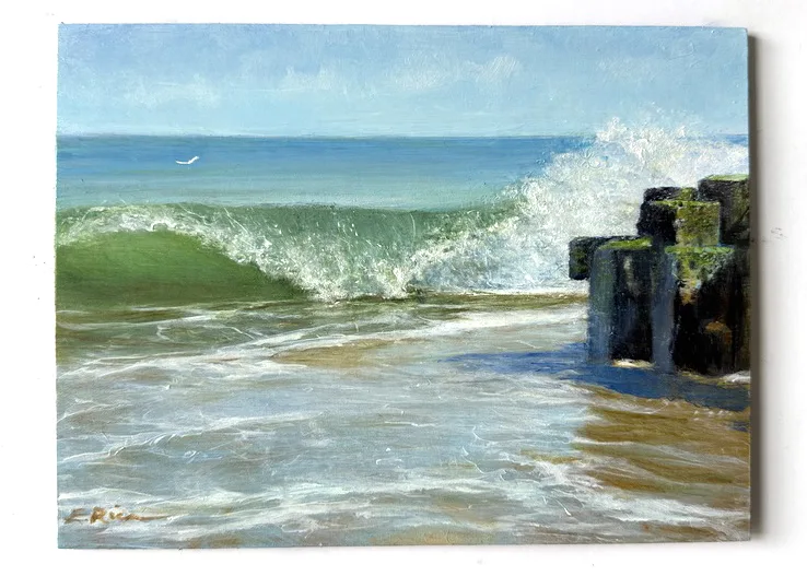 This small oil painting pictures a wave splashing onto the shore with sea foam flying over the end of a jetty and swirling around in the shallows, as one seagull swoops over the 