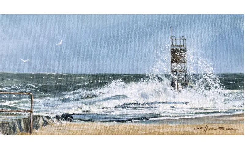 Seafoam swirls around the tower on the south jetty of Indian River Inlet, Delaware. This is one of the region's most beloved fishing spots, but the rocks are dangerous!